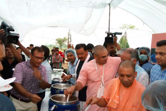 UP Chief Minister serves food to Akshaya Patra beneficiaries