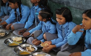 Childrens having akshaya patra mid day meals in Vrindavan school